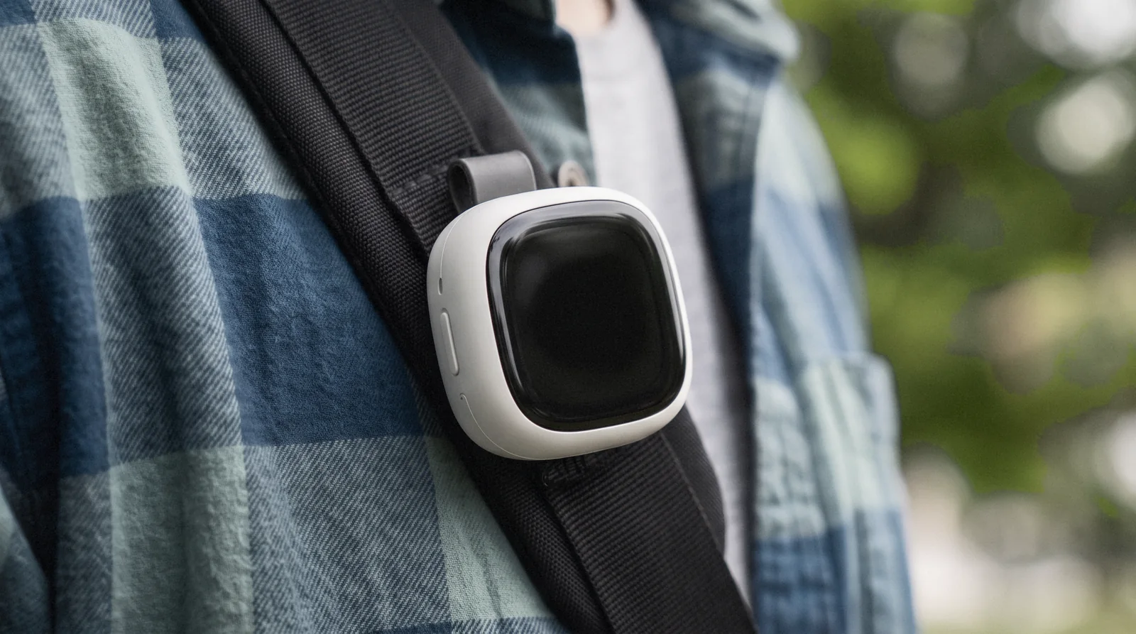 The clip camera on a backpack strap