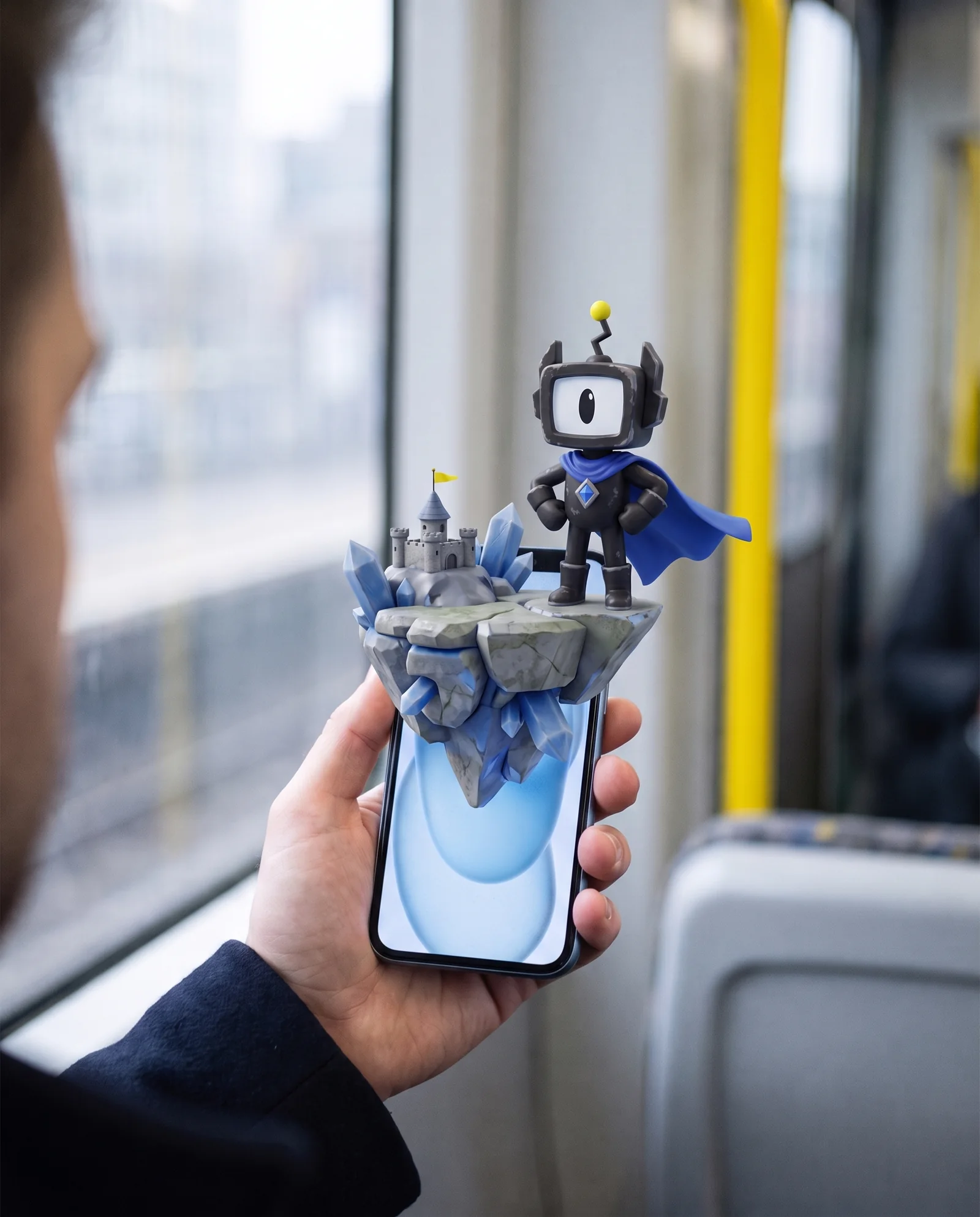 A player on a train, the game world rising out of the phone