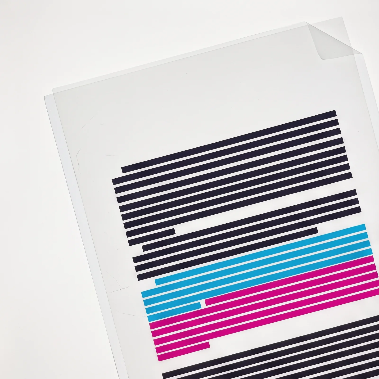 Stet key art: a contract under cyan and magenta film on a lightbox, only the difference in colour